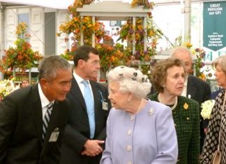 Her Majesty Queen Elizabeth II visits the gold medal winning Thai exhibit during the 2012 Chelsea Flower Show.